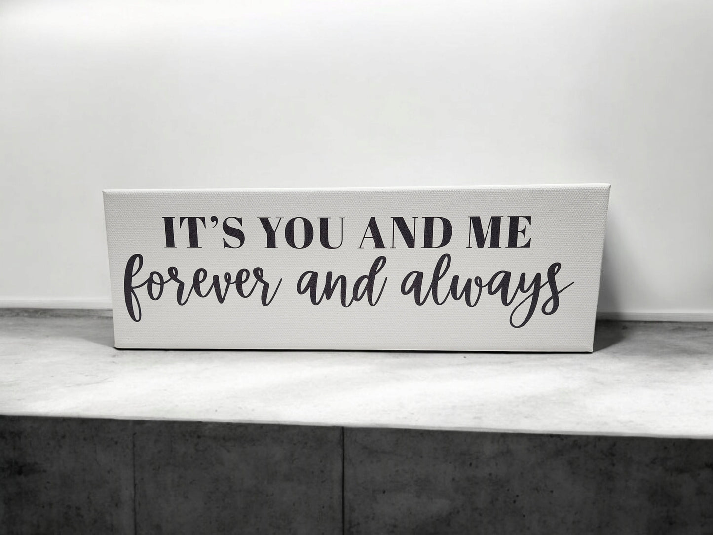 Mirabilia Boutique's 4x12 cradled canvas features "It's You and Me Forever and Always" in black script on a white and gray background, adding a timeless touch to your decor.