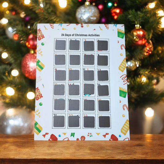 A 24 Days of Christmas Activities Scratch Off Calendar by Mirabilia Boutique features 24 numbered squares and stands before a decorated tree adorned with twinkling lights and ornaments. This holiday décor piece boasts vibrant, seasonal designs around the edges.