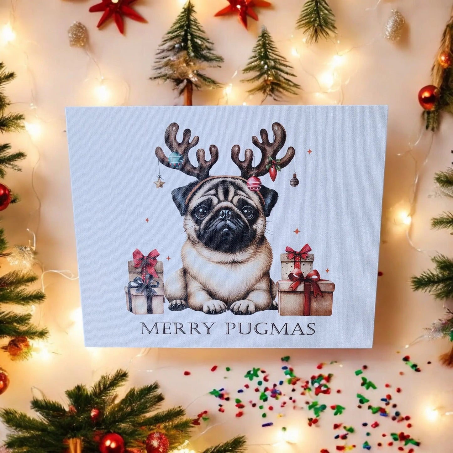 The Mirabilia Boutique's Merry Pugmas 10x8 Canvas Sign showcases a charming pug adorned with reindeer antlers and a red nose, amidst wrapped gifts. The phrase "Merry Pugmas" graces the bottom, set against a backdrop of festive holiday decor including trees, stars, and lights to create a delightful holiday ambiance.