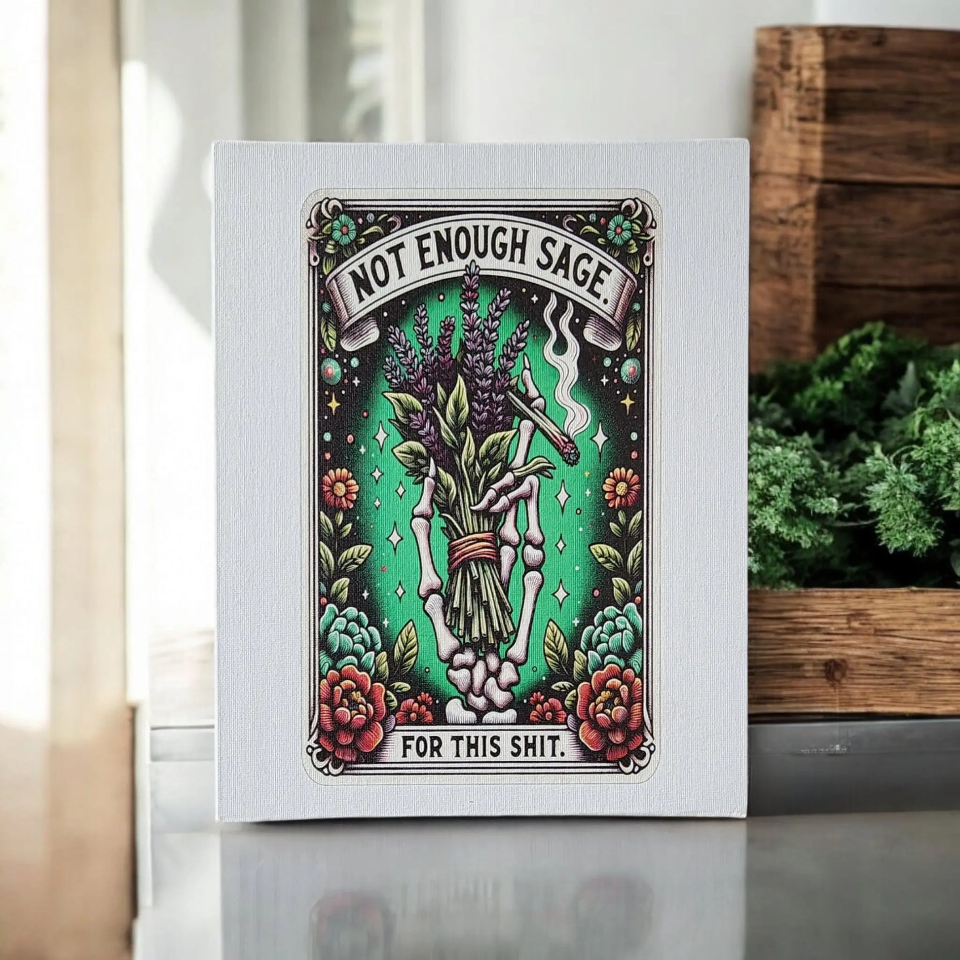 Add a touch of humor to your space with the "Humorous Sage Quote Wall Art Print for Home or Office Decor" from Mirabilia Boutique. This rectangular canvas features a skeleton hand holding sage surrounded by flowers and smoke, all set against a green background. The banners boldly state, "Not Enough Sage for this Shit." Perfectly complementary to a white wall with nearby greenery, it brings wit and charm to any room.